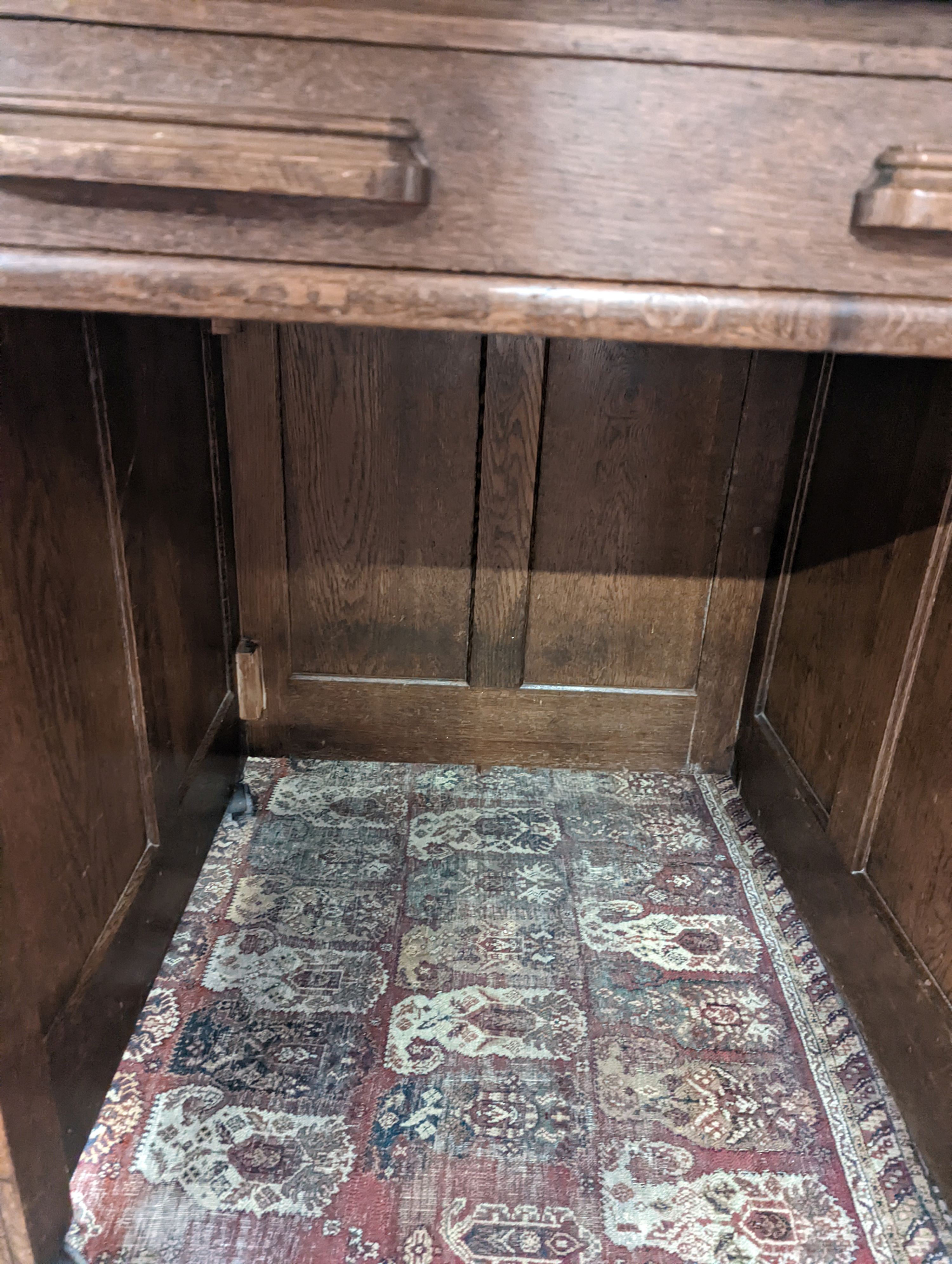 An early 20th century oak roll top desk with 'S' shaped tambour, width 106cm, depth 75cm, height 119cm